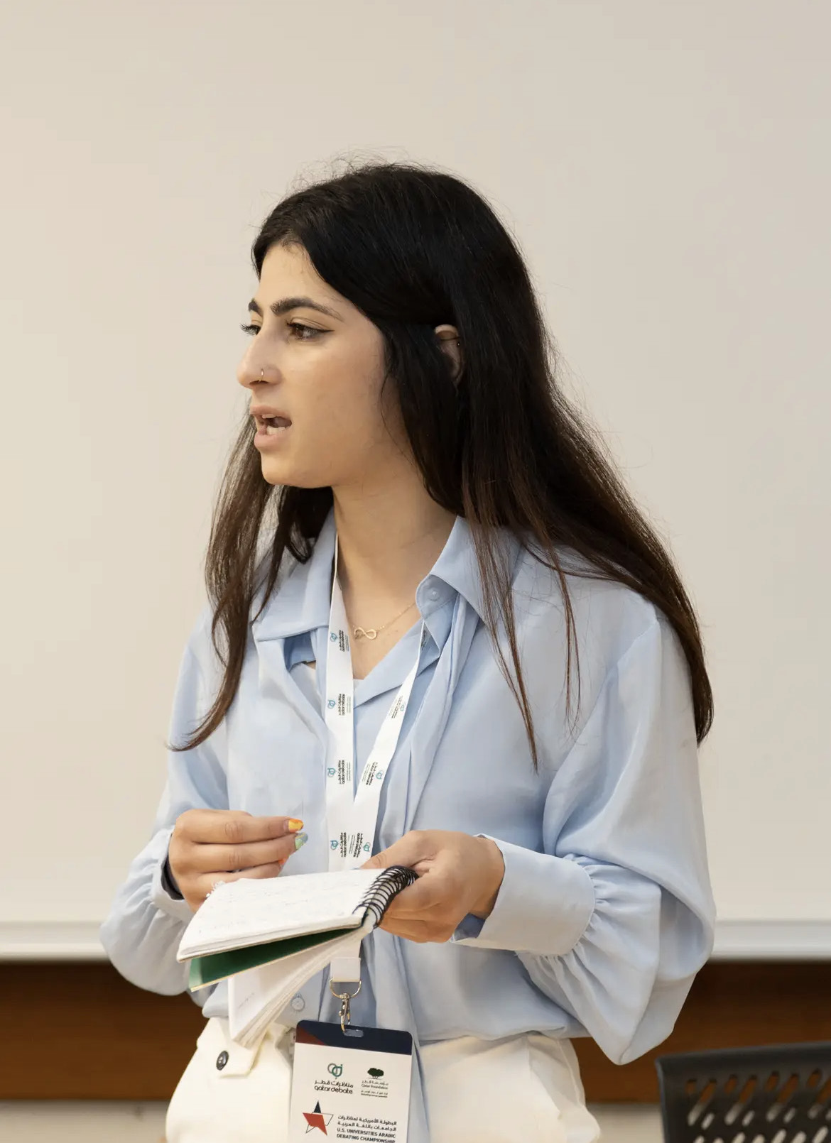 Young woman speaks at 3rd U.S. Universities Arabic Debating Championship 