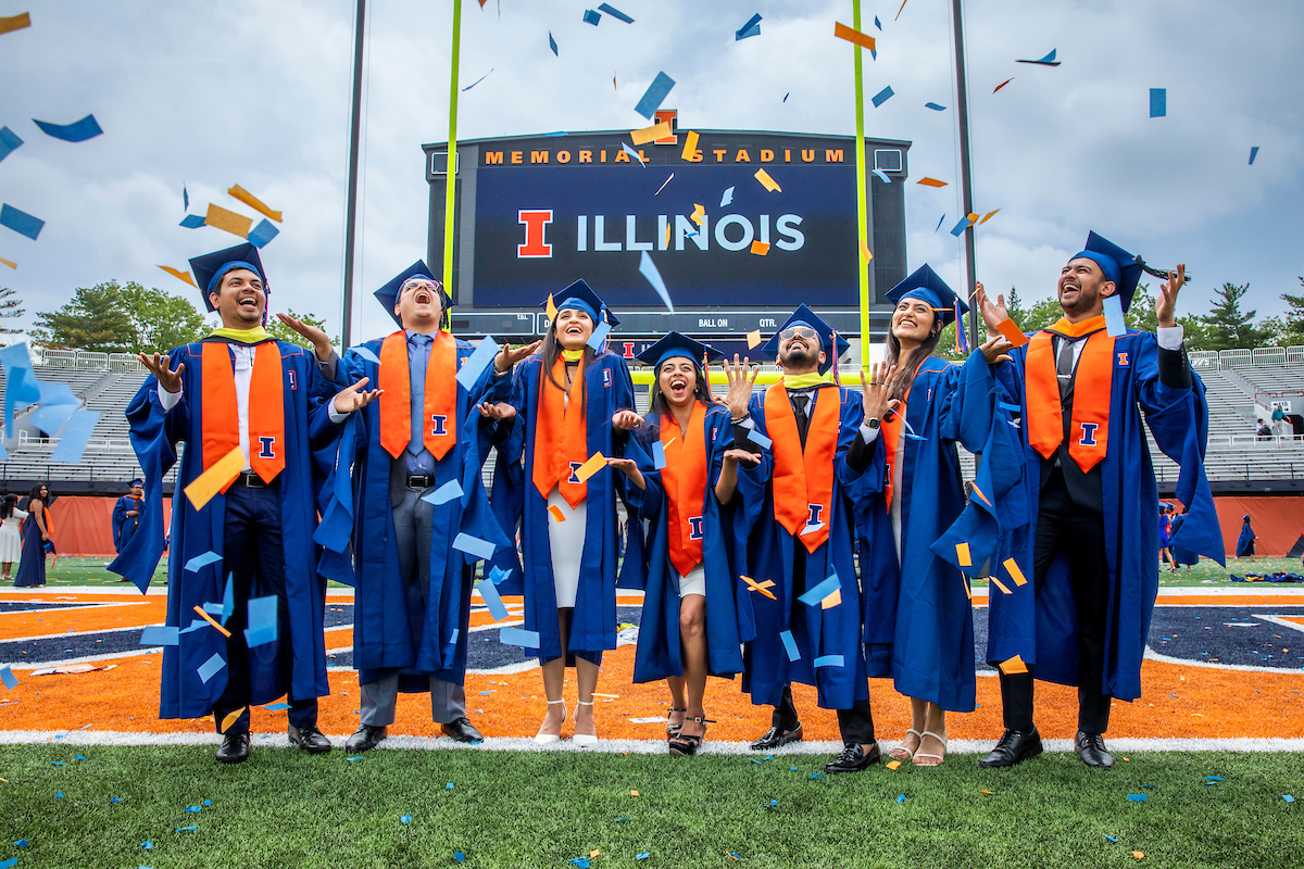 Students celebrate their accomplishments as graduates with confetti at the University of Illinois Urbana-Champaign Commencement Ceremony at Memorial Stadium on May 13, 2023.