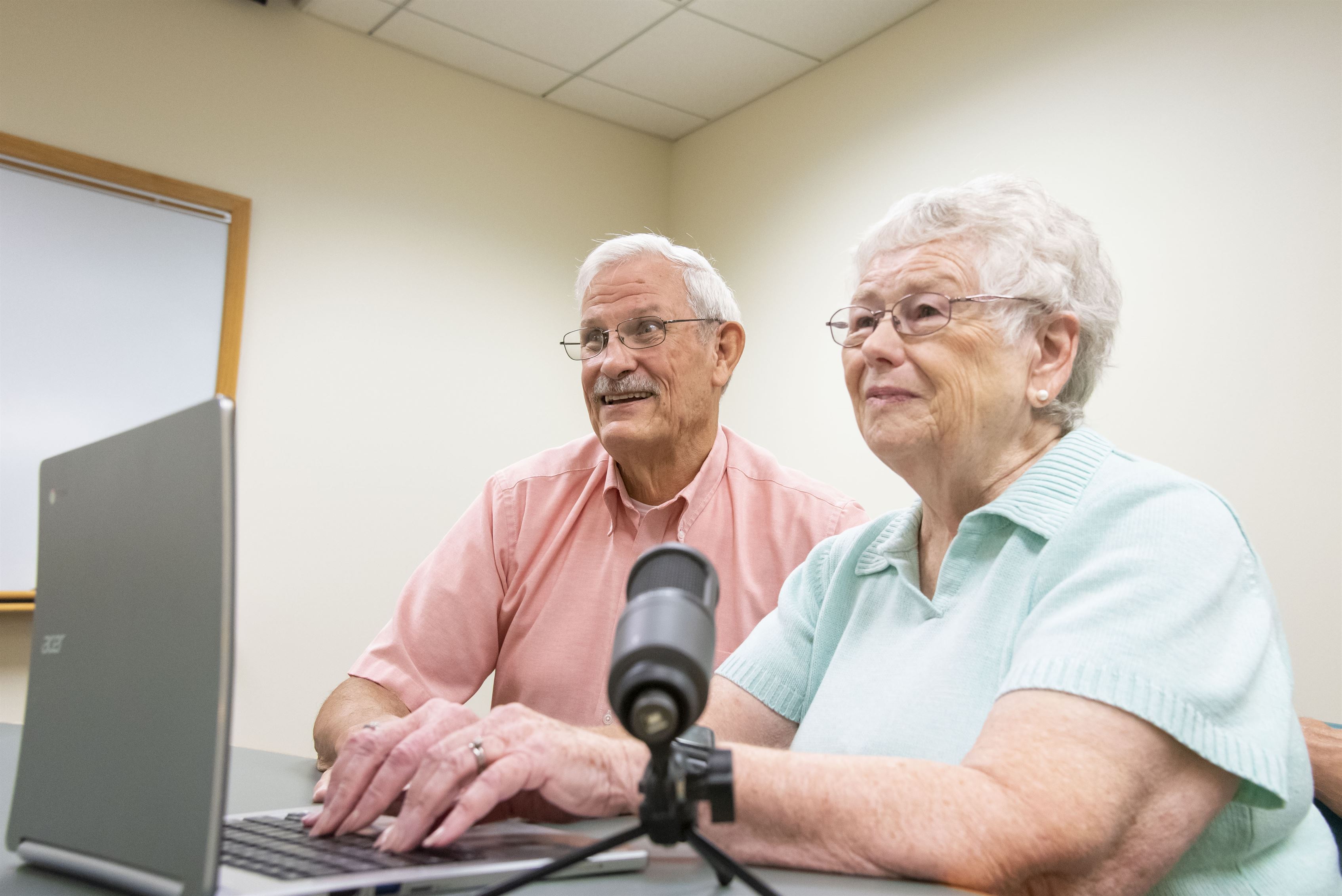 Couple recording with laptop