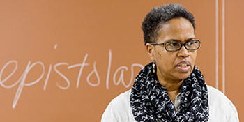 Teacher in front of blackboard