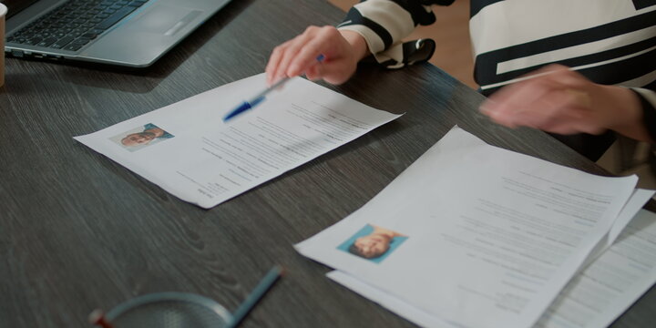 Office worker analyzing resumes
