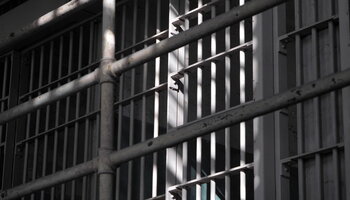 Iron bars on jail cell
