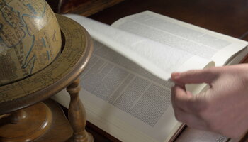Turning a page of an old book