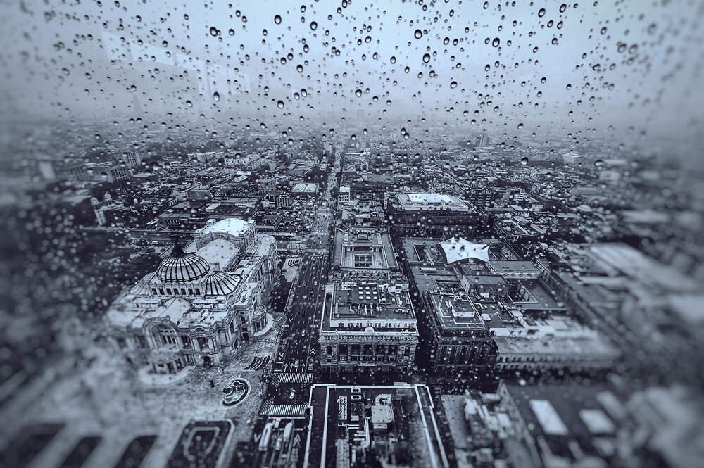 Water drops flow and settle on the windows of the Torre Latinoamericana in Mexico City.
