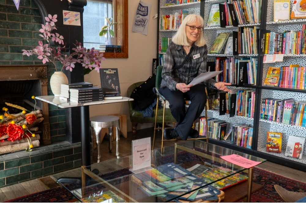 Woman reading from book at Literary launch