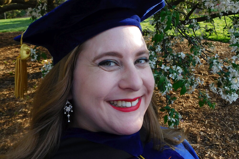 Woman in graduation cap and gown
