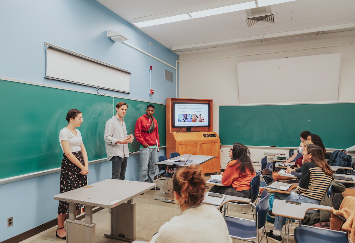 Students presenting in SLCL classroom