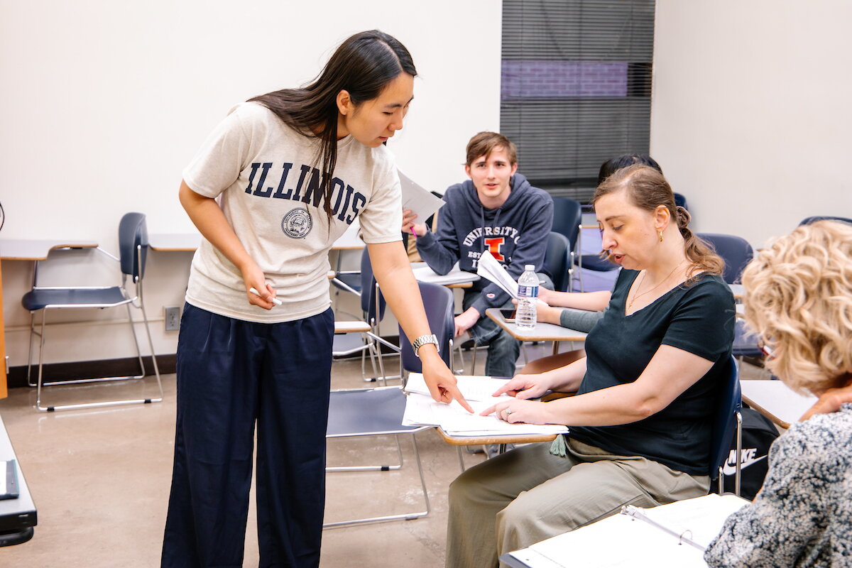 ILIP instructor helping student in classroom