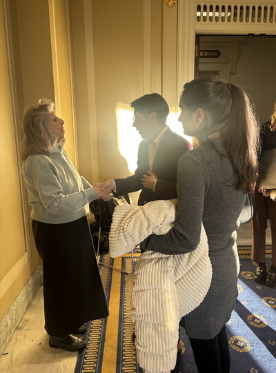 Members of the Illinois delegation speak with woman in D.C.