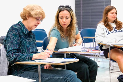 ILIP students help each other in classroom