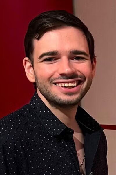 Smiling man in black shirt