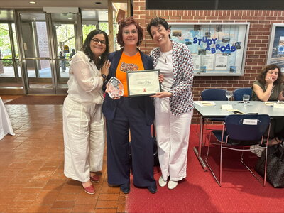 Three women at award ceremony
