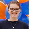 Smiling college student in glasses and Illinois t-shirt