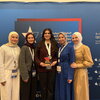 Arabic debate team poses with award
