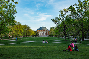 Students sitting on grass on Quad 
