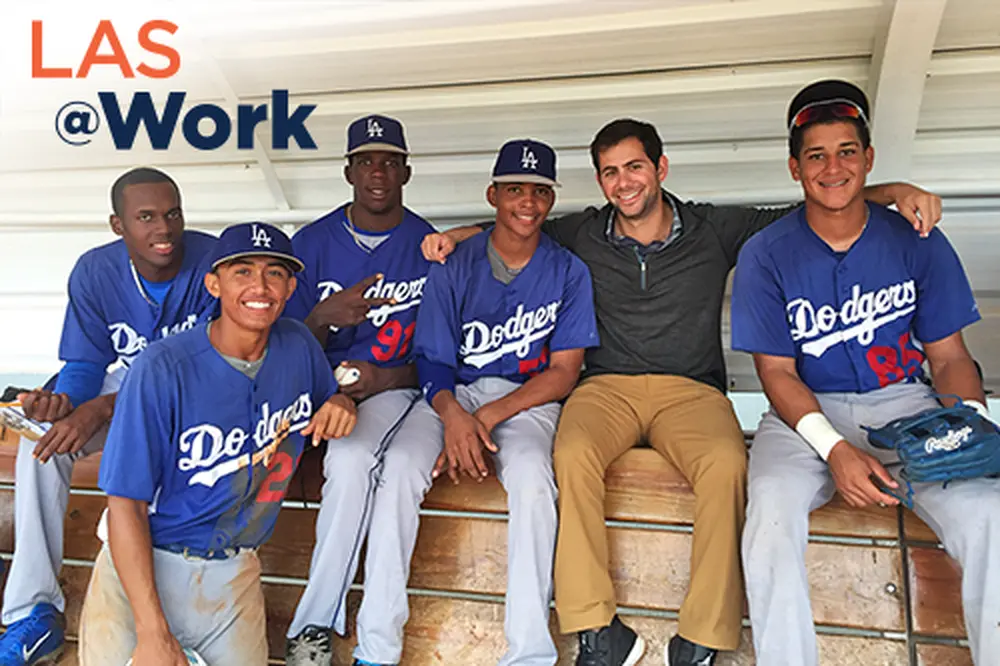 Matthew Doppelt Man sitting with group of baseball players