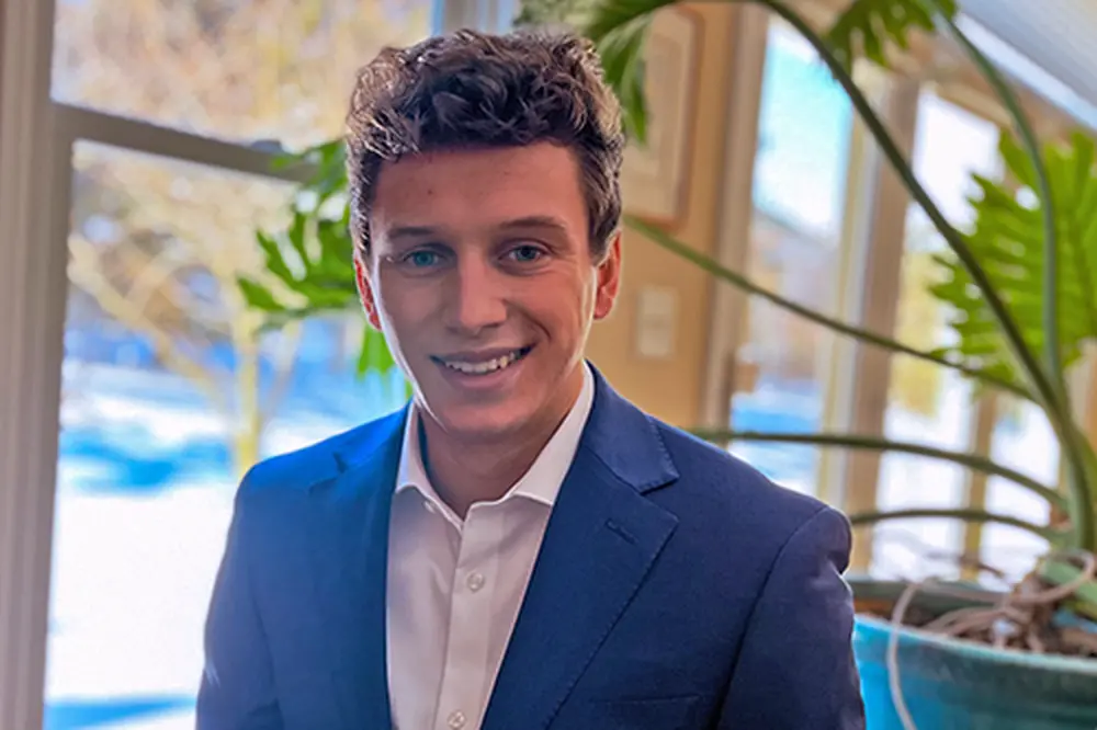 Smiling student in button down and blazer