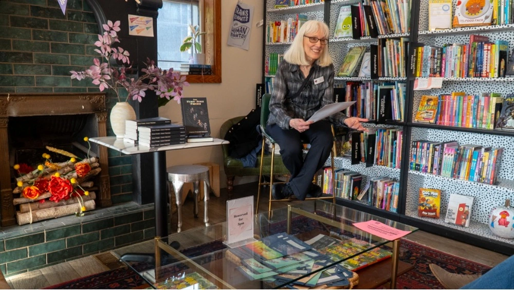 Woman reading from book at Literary launch