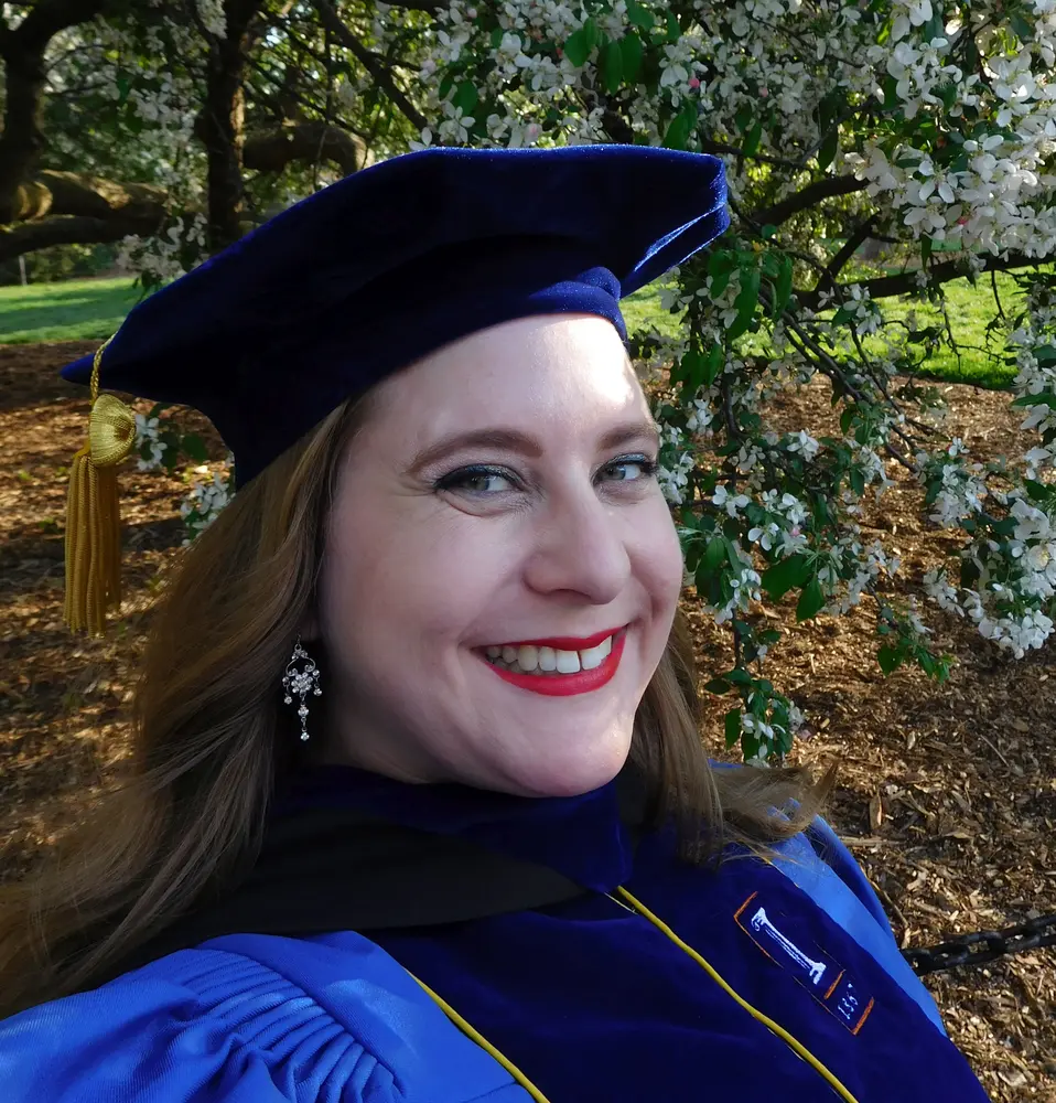Woman in graduation cap and gown