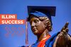 Alma Mater statue wearing a graduation cap and robe with the text "Illini success" 