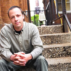 Man sitting on stairs 