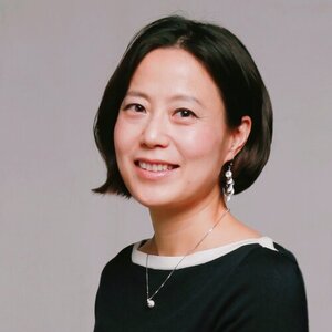 Smiling woman with short dark hair and black blouse 