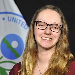 Smiling young woman in glasses