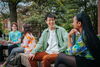 Students sitting on benches and talking